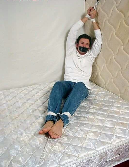 Man Tied To Bed